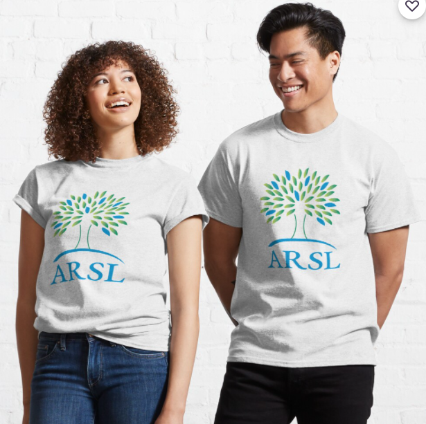 Two people wearing white ARSL logo t-shirts.