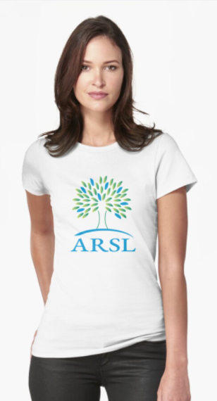 Person wearing a fitted white ARSL logo t-shirt.