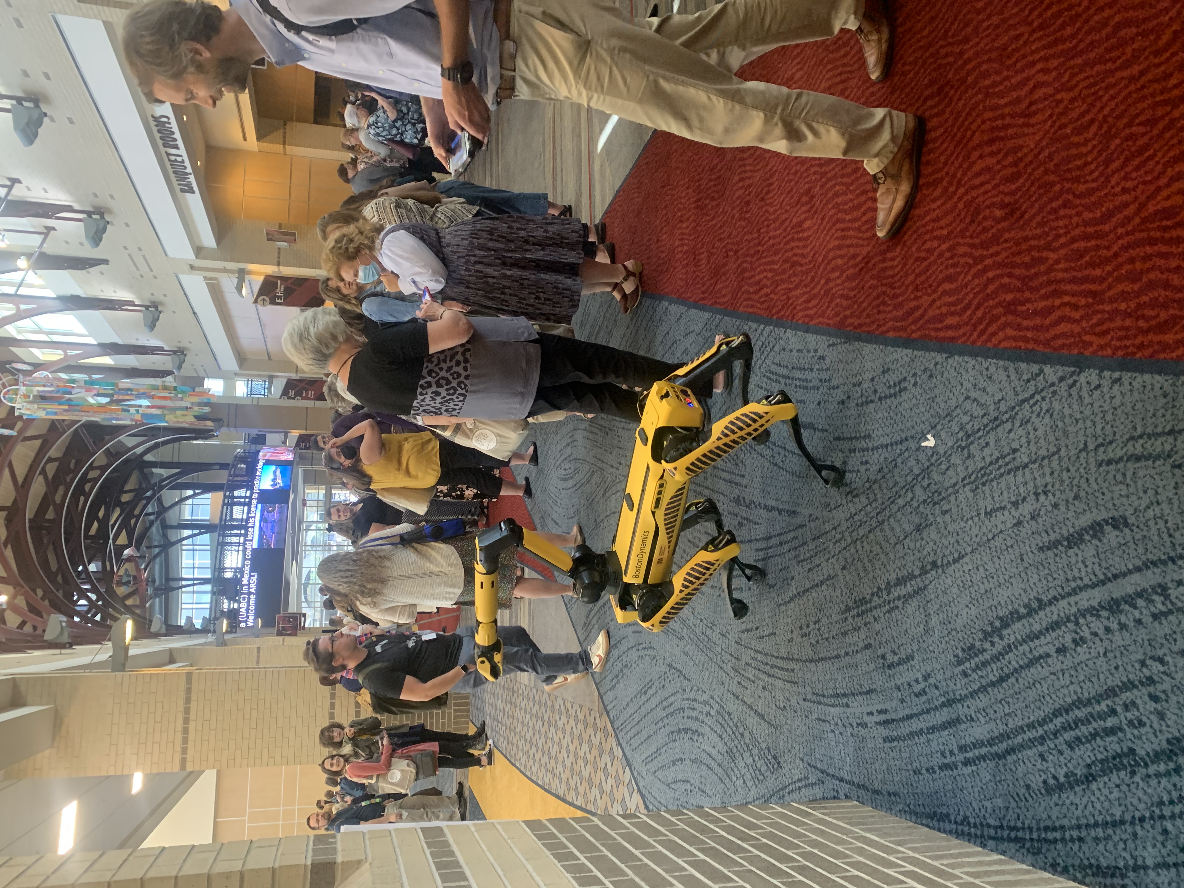 Boston Dynamics robotic dog walking through ARSL conference.