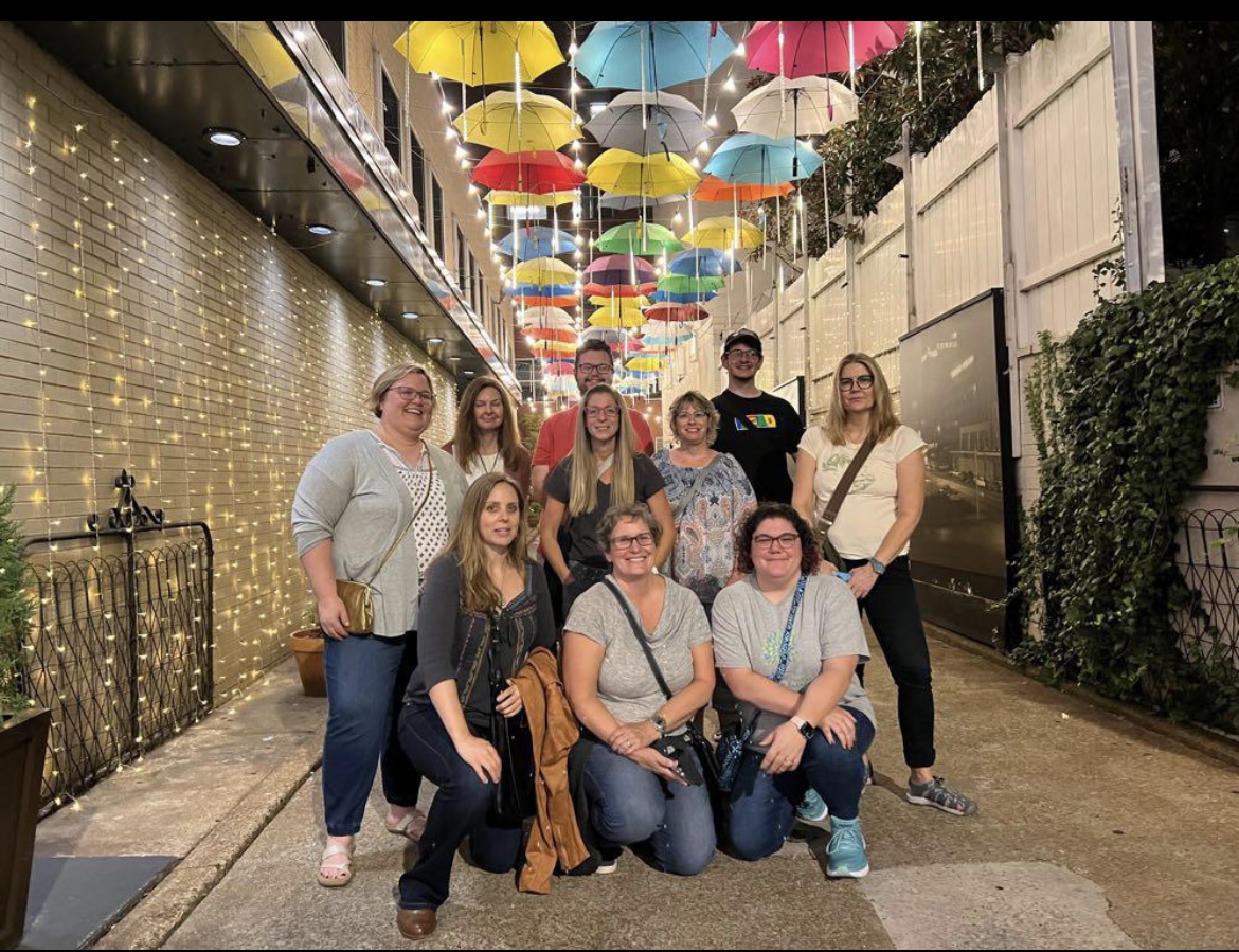 Group of ARSL conference attendees posed in front of Chattanooga's Umbrella Alley.
