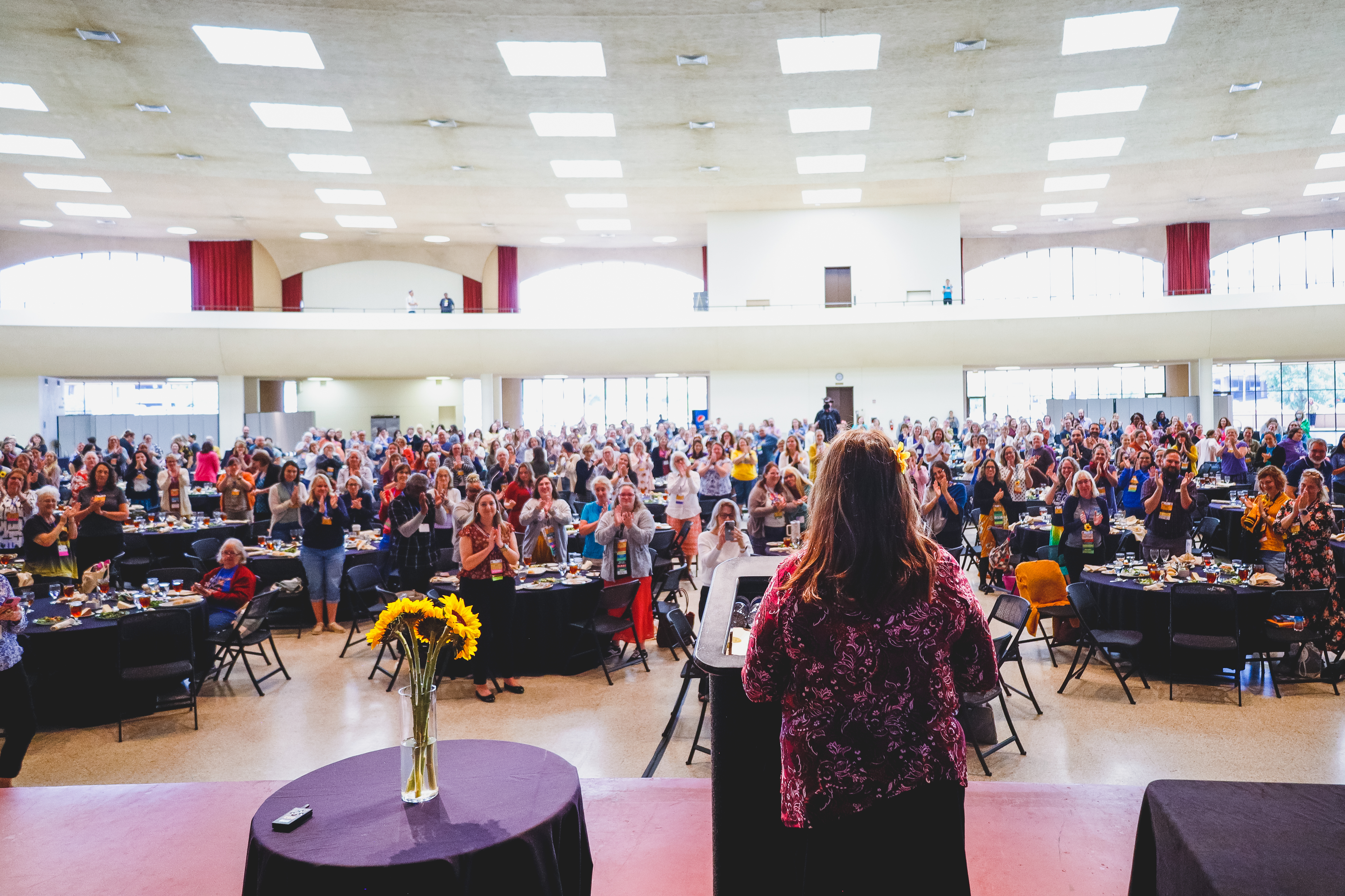 ARSL speaker addressing the main hall full of conference attendees.